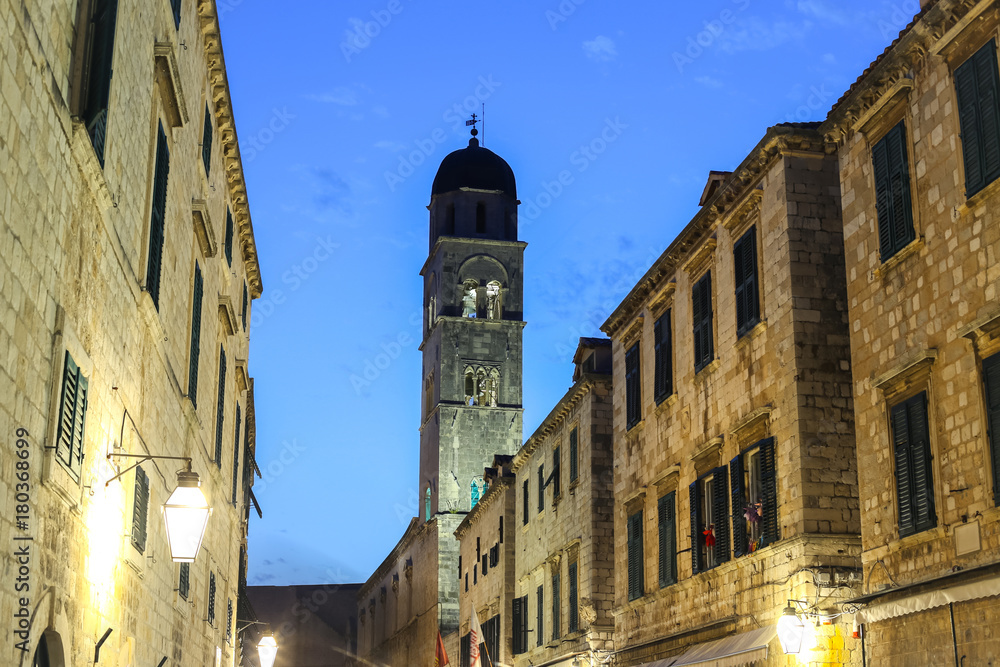 The bell tower of the Franciscan church and monastery in the main city street Stradun in Dubrovnik, Croatia.