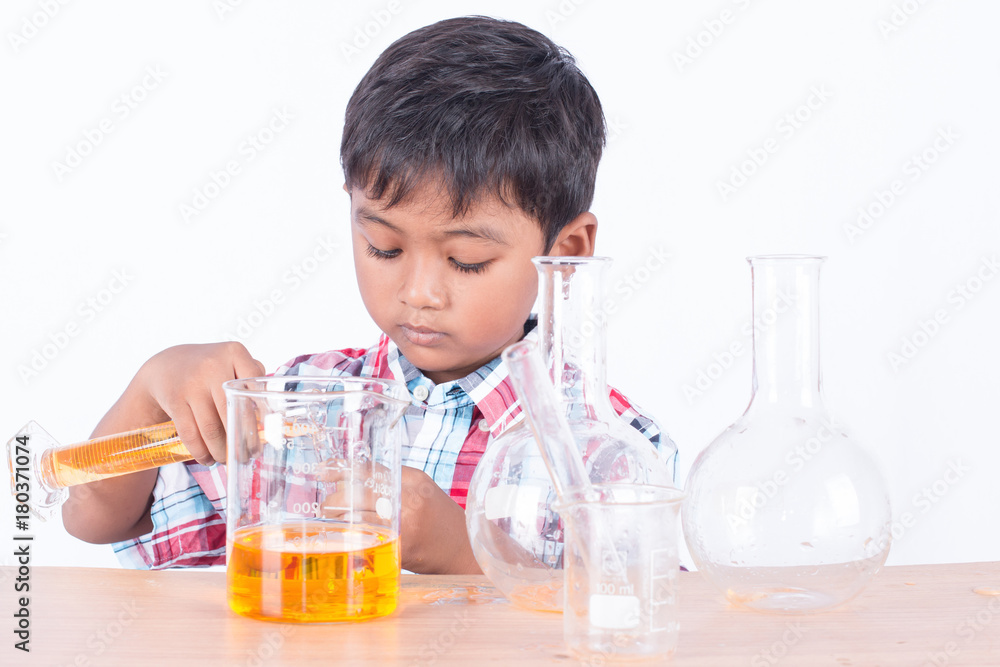 Cute little boy doing science experiment, science Education Cute little boy doing science experiment, science Education