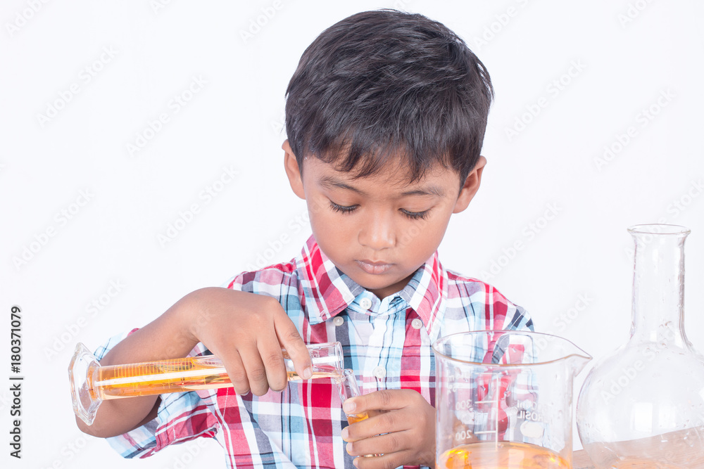 Cute little boy doing science experiment, science Education Cute little boy doing science experiment, science Education