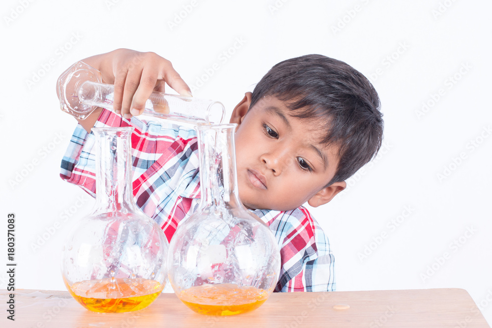 Cute little boy doing science experiment, science Education Cute little boy doing science experiment, science Education