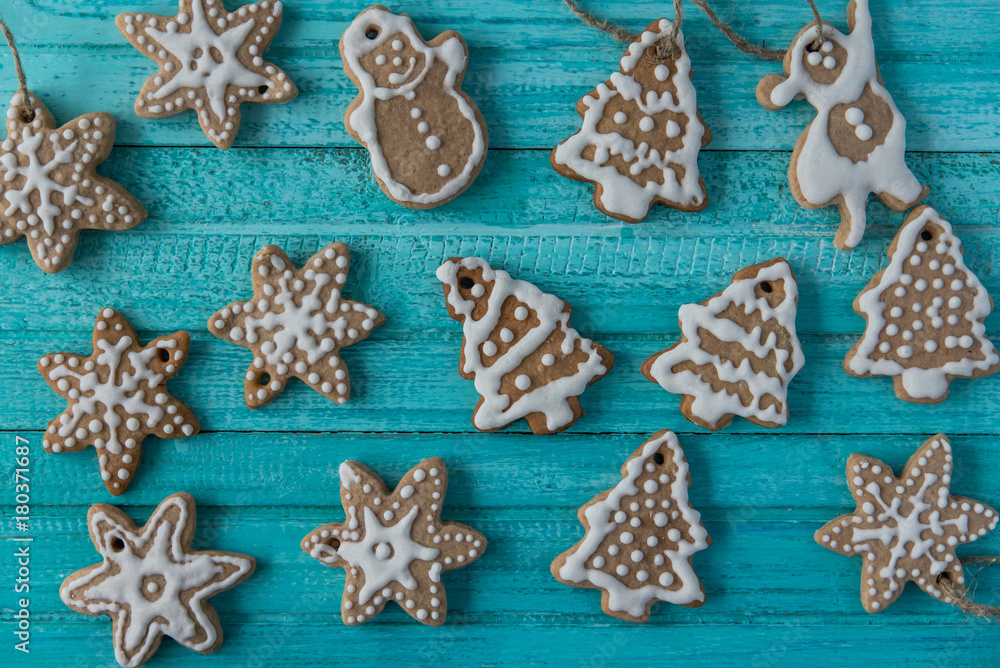 ginger cookies in the form of Christmas toys on dark blue background