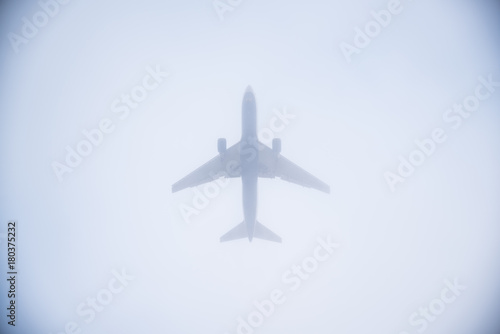 Airplane landing through the fog