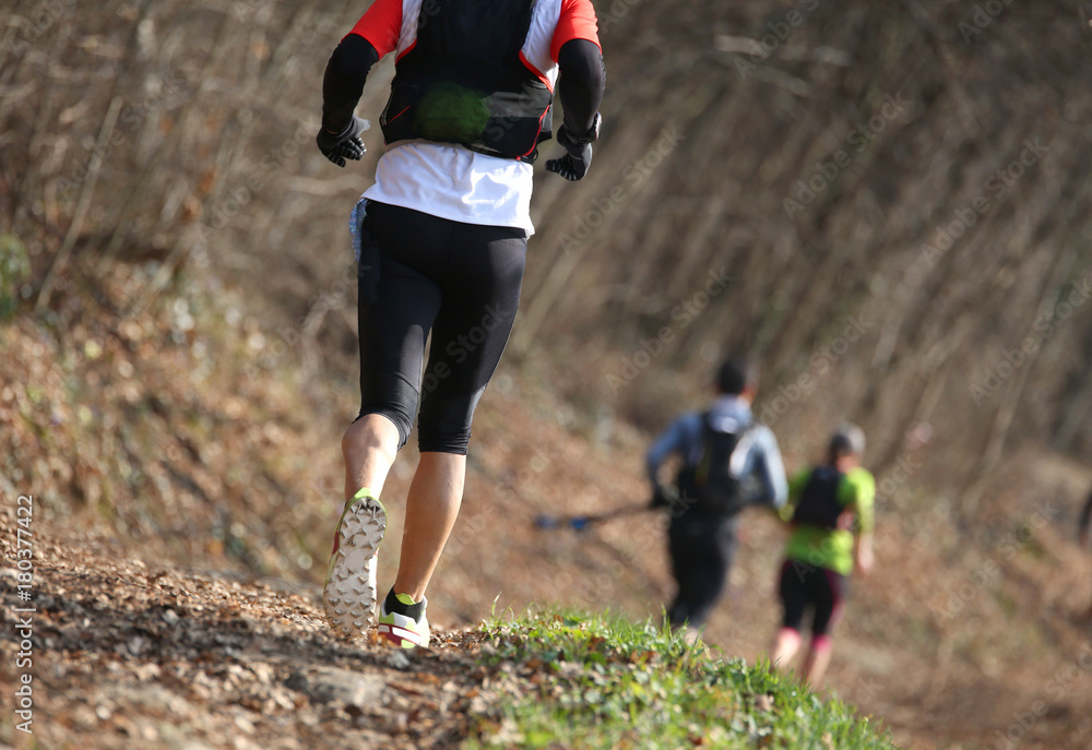 runner during the country race on the trail