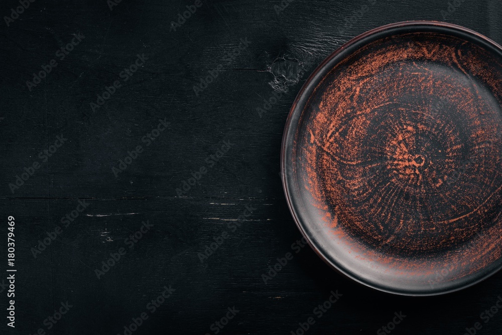 Clay dishes. Plate. Top view. Free space for your text. Clay dishes. Plate. Top view. Free space for your text.