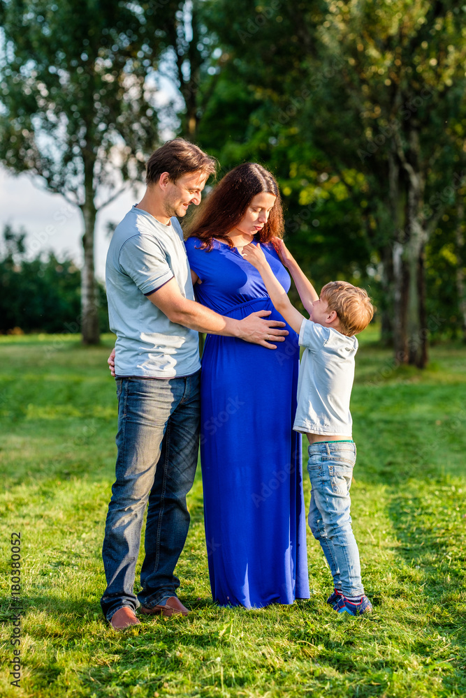 Happy pregnant family of three expecting new baby Happy pregnant family of three expecting new baby