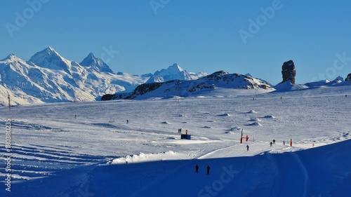Ski slopes on the Diablerets glacier. Famous rock Quille du Diable. Winter scene in Switzerland.