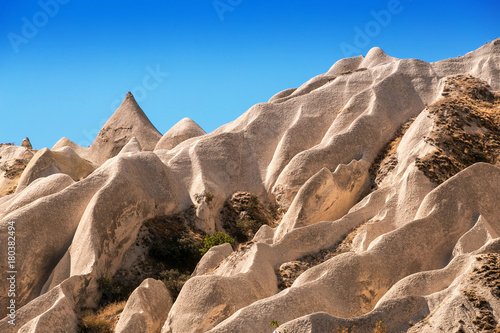 Frozen volcanic tuff waves and scenic landscape of the Rose Valley in Cappadocia, national park Goreme, Turkey. photo