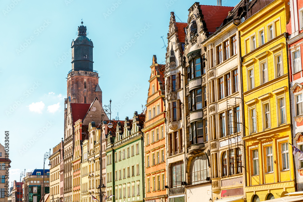 Fototapeta premium Fantastic view of the ancient homes on a sunny day. Location famous Market Square in Wroclaw, Poland, Europe. Historical capital of Silesia. Beauty world.