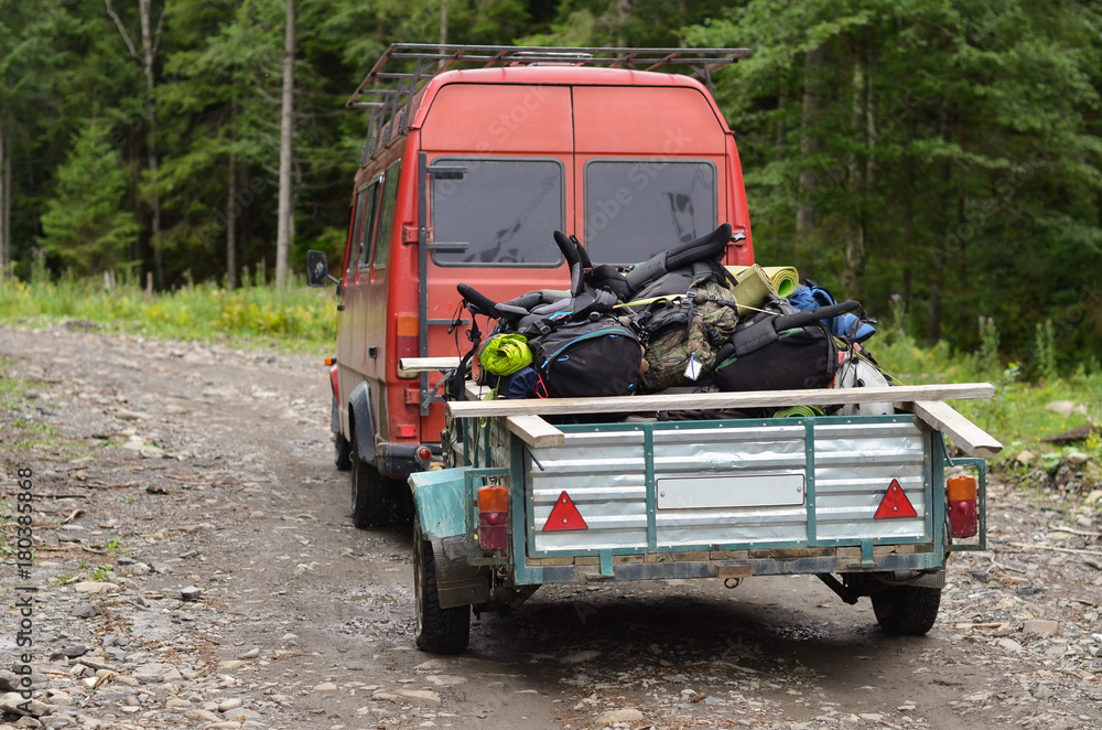 backpacks of hikers is carry on car