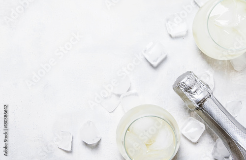 Alcohol Cocktail Prosecco On The Rocks With Sparkling Wine And Ice Cubes, Gray Background, Top View