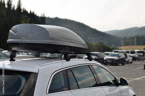 Car with the roof rack with cargo box