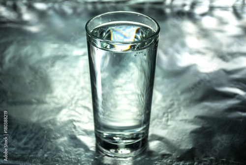 Wallpaper Mural Glass of water on silver abstract background Torontodigital.ca