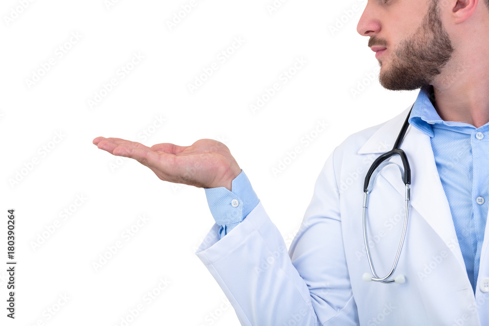 Portrait of a Young smiling male doctor pointing finger away isolated on a white background Portrait of a Young smiling male doctor pointing finger away isolated on a white background