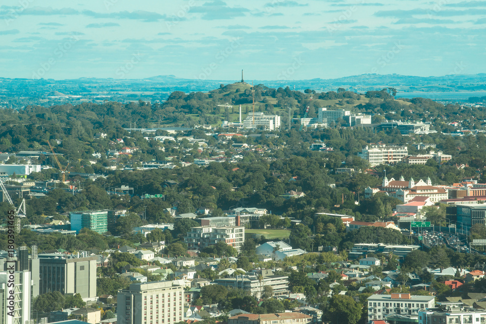 Auckland cityscape with One Tree Hill an iconic volcano of Auckland in the centre, North island of New Zealand.