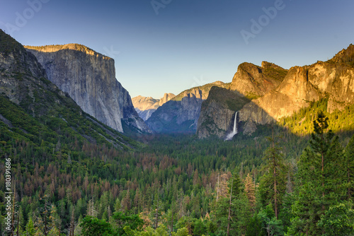 View of Yosemite Valley from Tunnel View point at sunset - view to Bridal veil falls, El Capitan and Half Dome - Yosemite National Park in California, USA