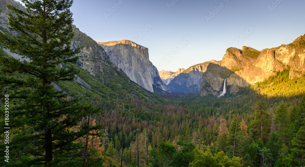 View of Yosemite Valley from Tunnel View point at sunset - view to Bridal veil falls, El Capitan and Half Dome - Yosemite National Park in California, USA