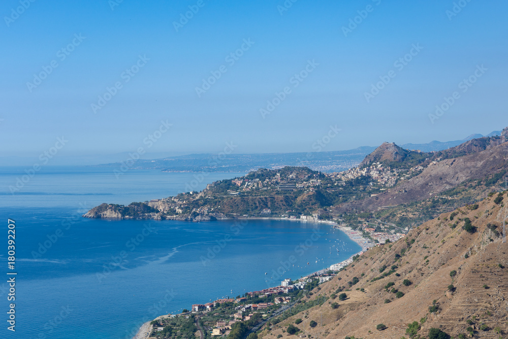 Taormina Bay in a summer day seen from Forza D'Agrò, Sicily