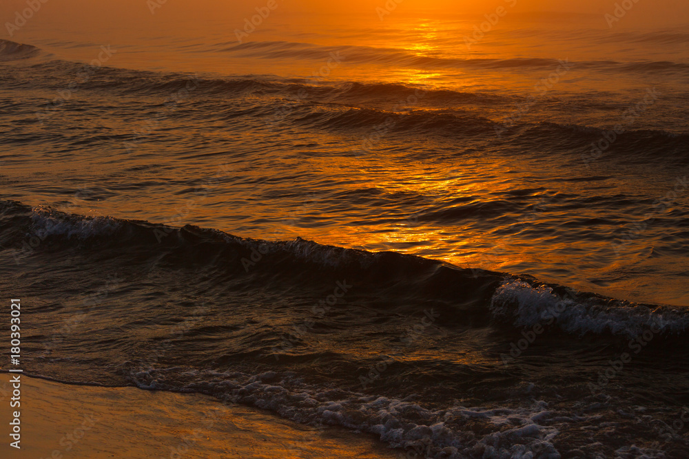Waving sea during sunset