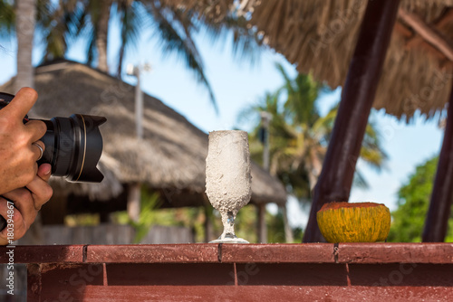 Camera takes a glass, Varadero, Matanzas, Cuba. Close-up.