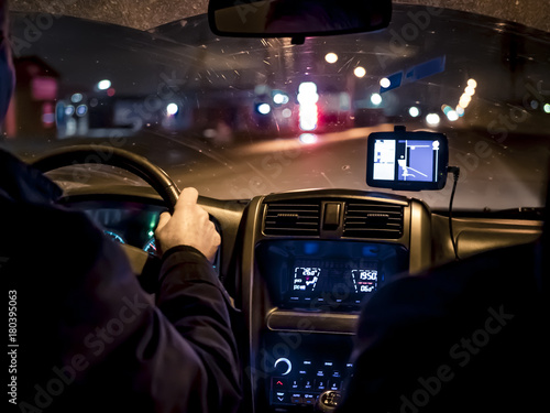 man, driving a car at night © Mihail