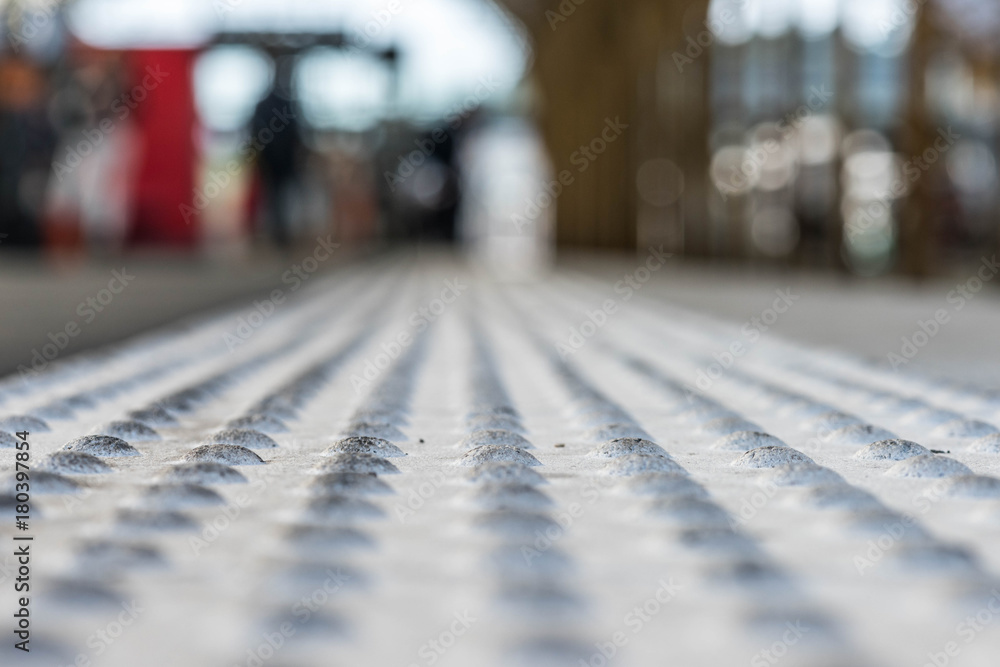 platform apron with waiting people on the background platform apron with waiting people on the background