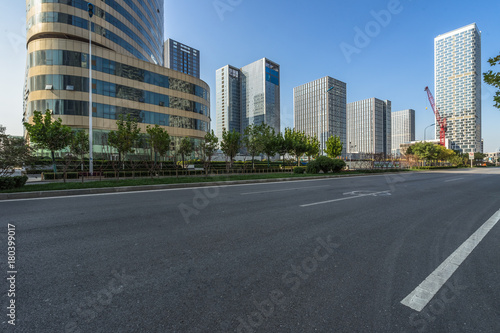 empty asphalt road with city skyline background in china.. © hallojulie