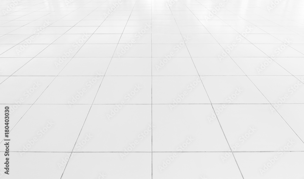 White tile floor background in perspective view. Clean, shiny, symmetry with grid line texture. For decoration in bathroom, kitchen and laundry room. And empty or copy space for product display also. White tile floor background in perspective view. Clean, shiny, symmetry with grid line texture. For decoration in bathroom, kitchen and laundry room. And empty or copy space for product display also.