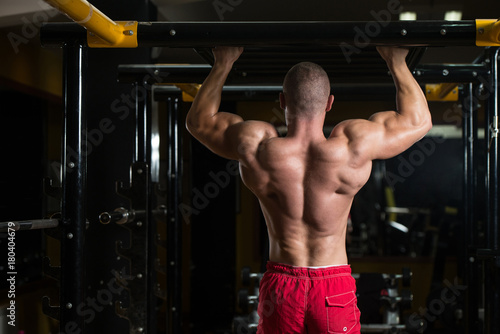 Bodybuilder Doing Pull Ups Best Back Exercises