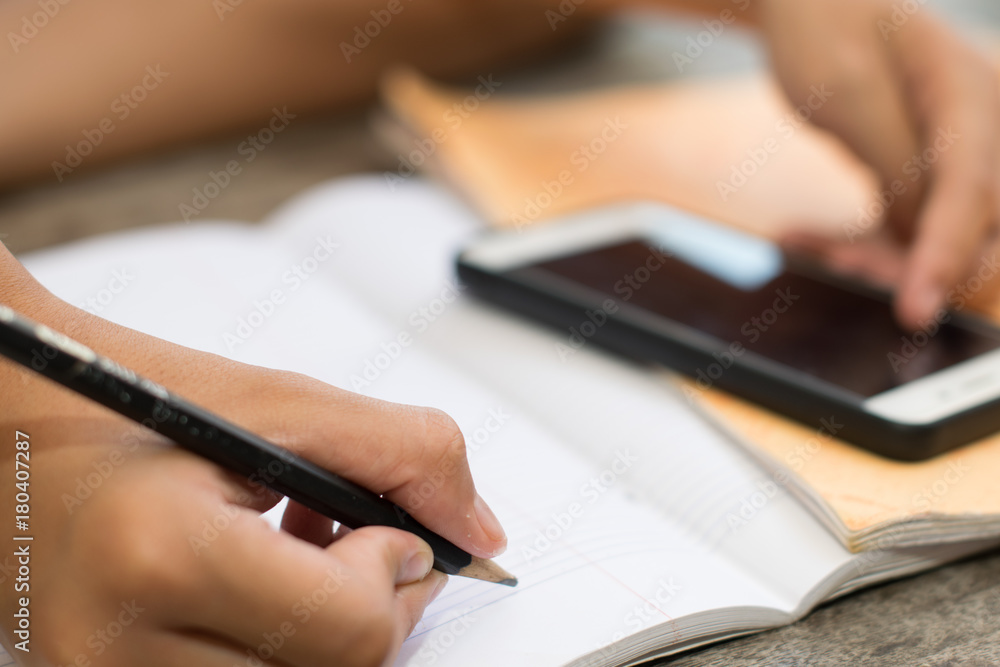 Male students are doing homework with intent. Search the Internet and in phone books. To prepare teachers. Male students are doing homework with intent. Search the Internet and in phone books. To prepare teachers.