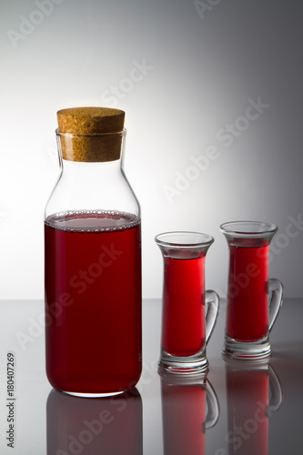 glasses of wine with a drop on the table on a background