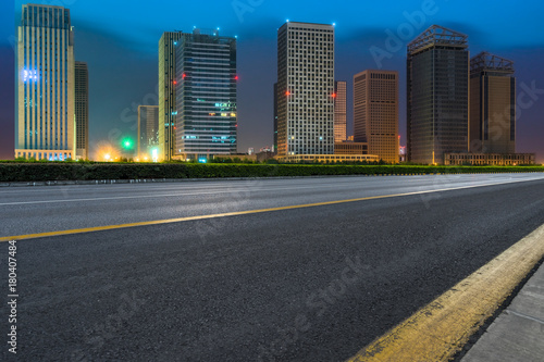 night view of Empty asphalt road through modern city © hallojulie