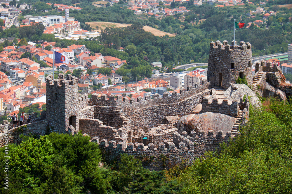 View of Castle of the Moors on the top of the mountain over the Sintra town. Sintra. Portugal