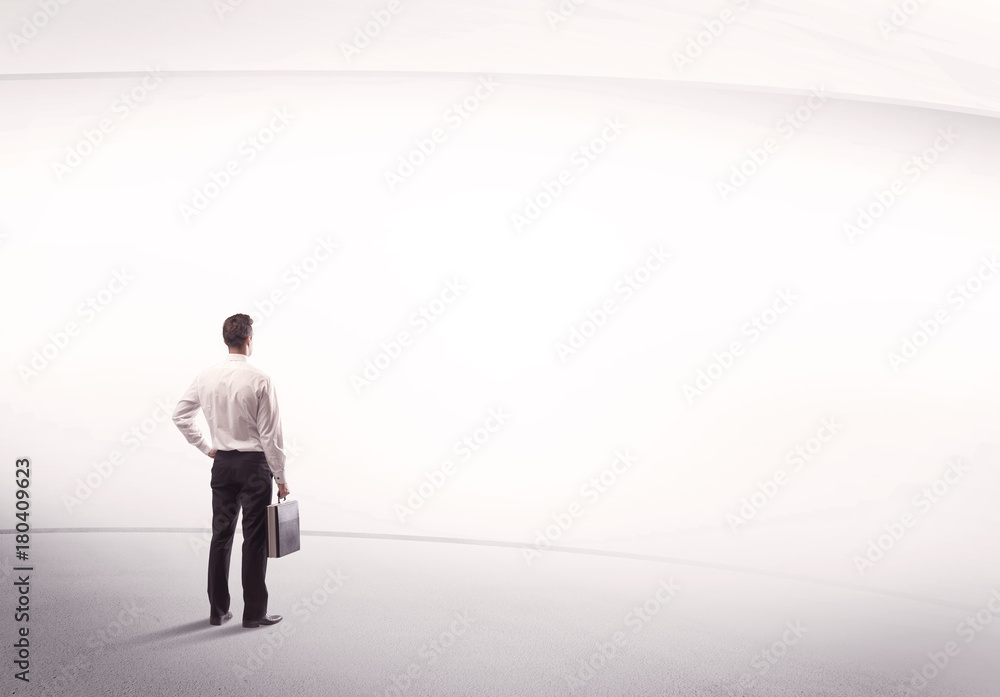 Businessman with briefcase standing still Businessman with briefcase standing still