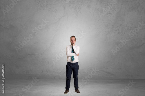 Alone businessman standing in a dark room © ra2 studio