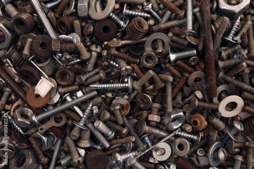 Abstract grunge metallic background. Old rusty screw. Building waste.