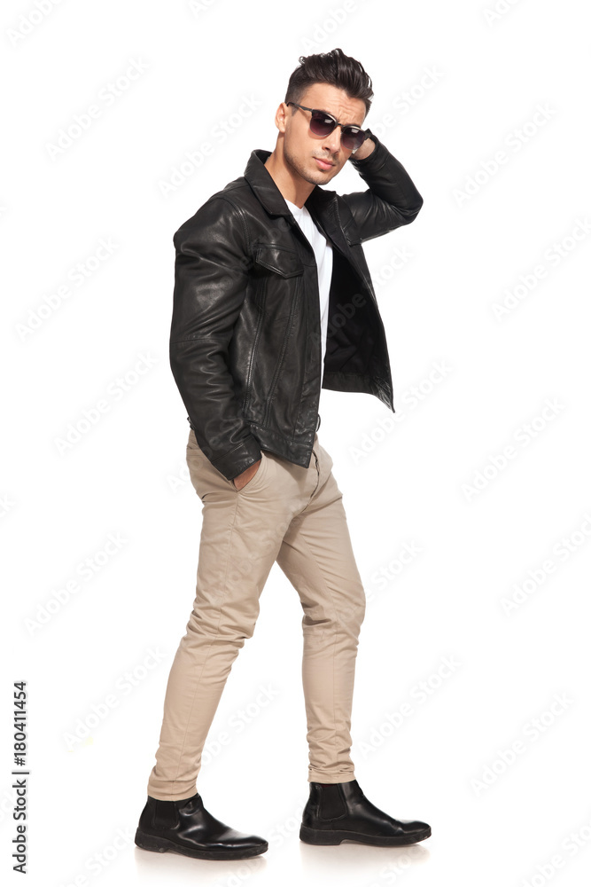 side view walking holding hand behind head side view walking holding hand behind head