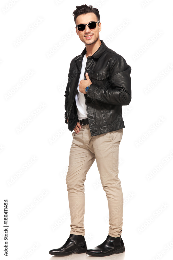 smiling young man in leather jacket and sunglasses smiling young man in leather jacket and sunglasses