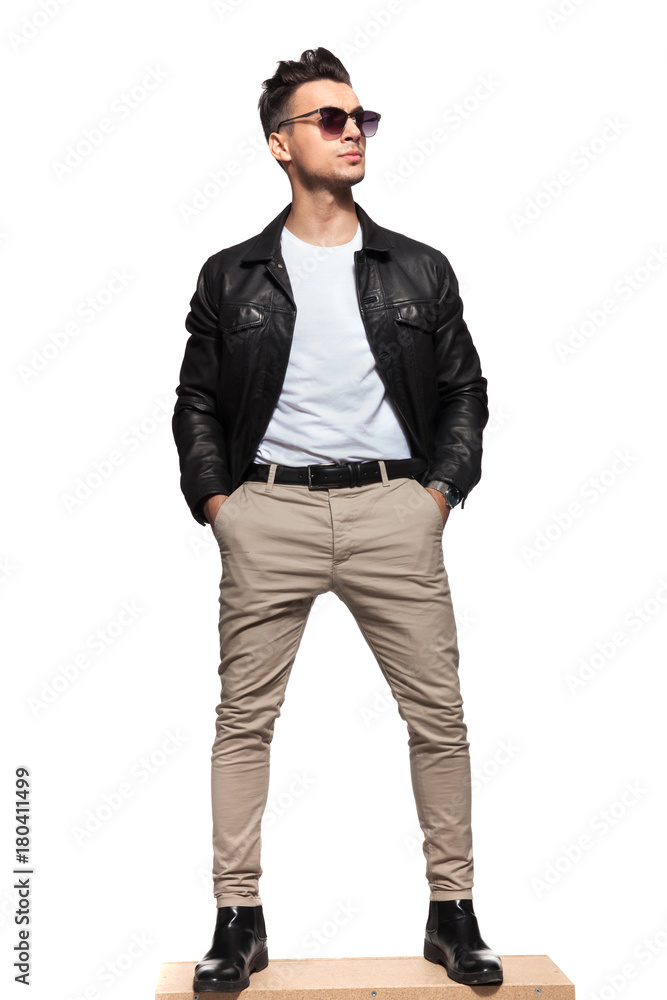 fashion man standing with hands in pockets fashion man standing with hands in pockets