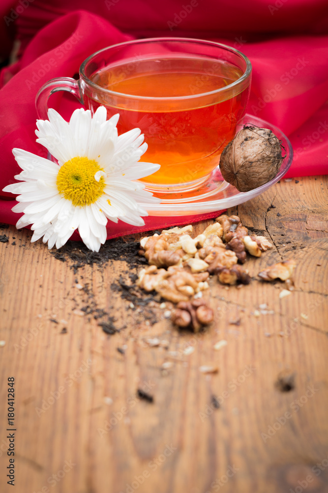 mug of tea with lemon and nuts on a wooden stand. I love autumn. I love tea. mug of tea with lemon and nuts on a wooden stand. I love autumn. I love tea.