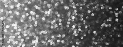 silver and white bokeh lights defocused. abstract background - panoramic
