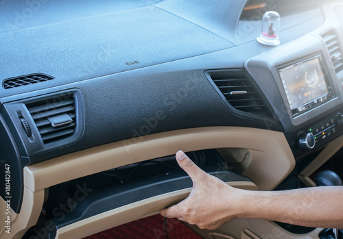 Fotografi Hand open glove compartment box in car