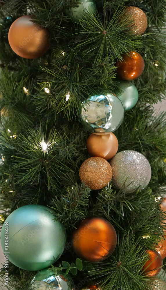 Tree decoration balls and garland close-up, vertical positioning Tree decoration balls and garland close-up, vertical positioning