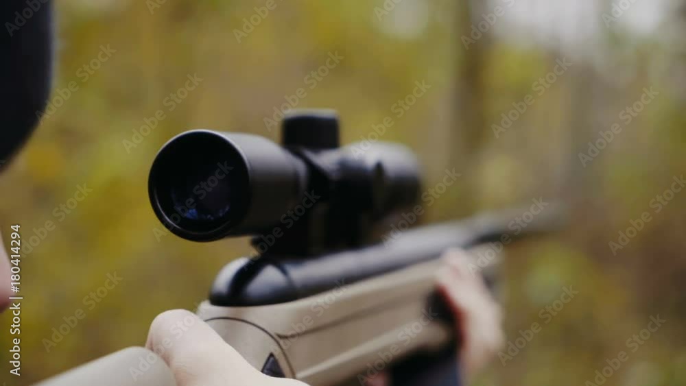 Hunter aiming for wildlife Hunter aiming for wildlife