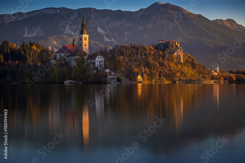 Bled, Slovenia - Beautiful autumn sunrise at Lake Bled with the famous Pilgrimage Church of the Assumption of Maria with Bled Castle and Julian Alps at background