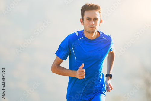 Athlete running in the mountains of the Italian national team in training
