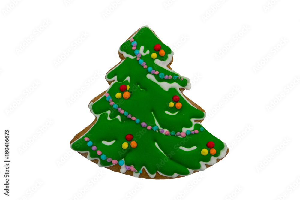 Christmas gingerbread cookie made in shape of Christmas tree isolated on white background Christmas gingerbread cookie made in shape of Christmas tree isolated on white background