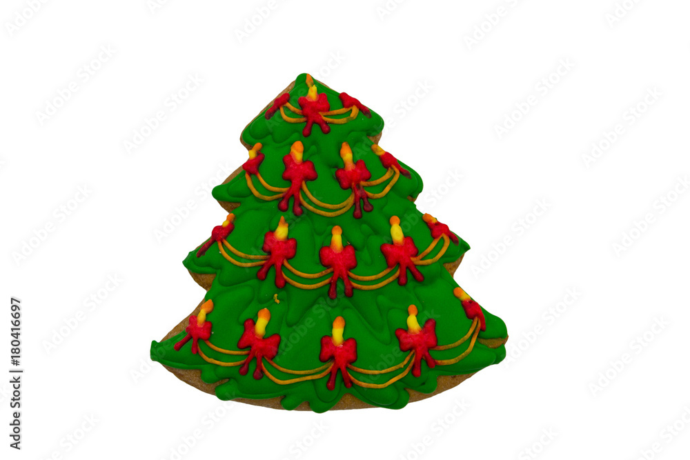 Christmas gingerbread cookie made in shape of Christmas tree isolated on white background Christmas gingerbread cookie made in shape of Christmas tree isolated on white background