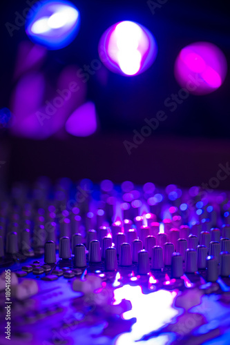 Sound music mixer control panel on colourful light