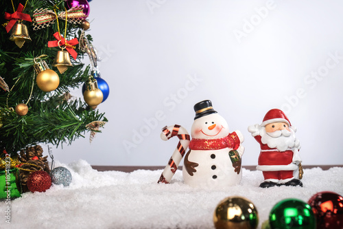 Christmas decoration Holiday or new year with Santa Claus and snowman on snow background and copy space
