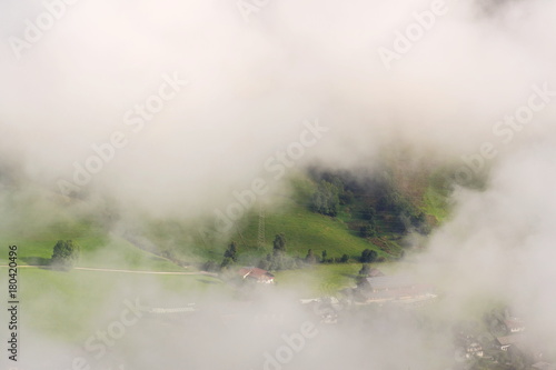 Fog in valley over Schladming, Dachstein Mountains, Alps, Austria